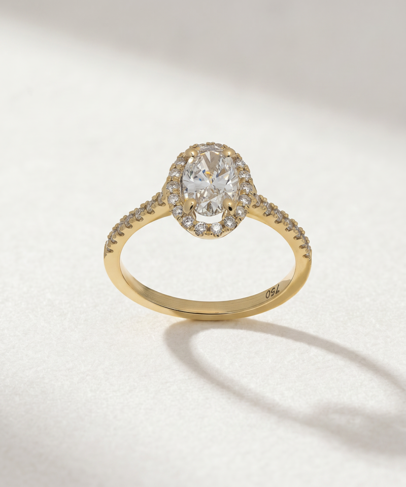 Alternative view of Oval Diamond Halo Ring in K18 Yellow Gold