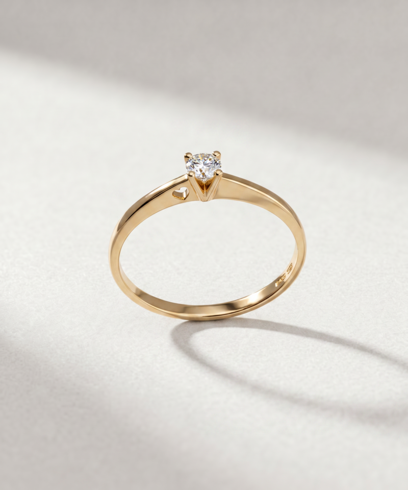Alternative view of Round-Cut Diamond Solitaire Ring with Heart Detail in K18 Yellow Gold