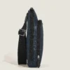 Side view of Montblanc Sartorial Tweed Blue bag with black strap and zip closures