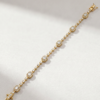 K18 yellow gold bracelet with emerald-cut diamond motifs