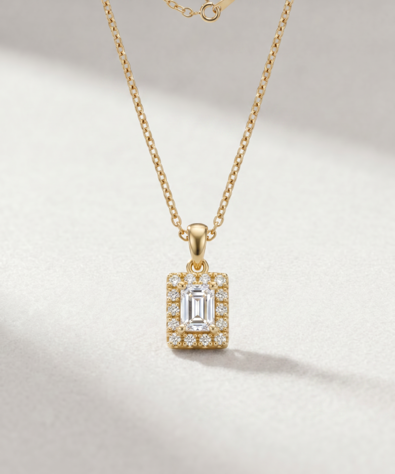 Emerald-cut diamond halo pendant in K14 yellow gold