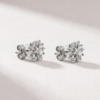 Side view of K18 white gold diamond cluster earrings with butterfly backs