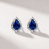 Pear-cut sapphire and diamond halo earrings in K18 white gold shown from the front