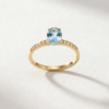 Oval-cut blue topaz ring with cubic zirconia in K14 yellow Oval-cut blue topaz ring with cubic zirconia in K14 yellow gold