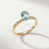 Oval-cut blue topaz ring with cubic zirconia in K14 yellow Oval-cut blue topaz ring with cubic zirconia in K14 yellow gold