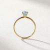 Oval-Cut Blue Topaz Ring with Cubic Zirconia in K14 Yellow Gold - Image 3